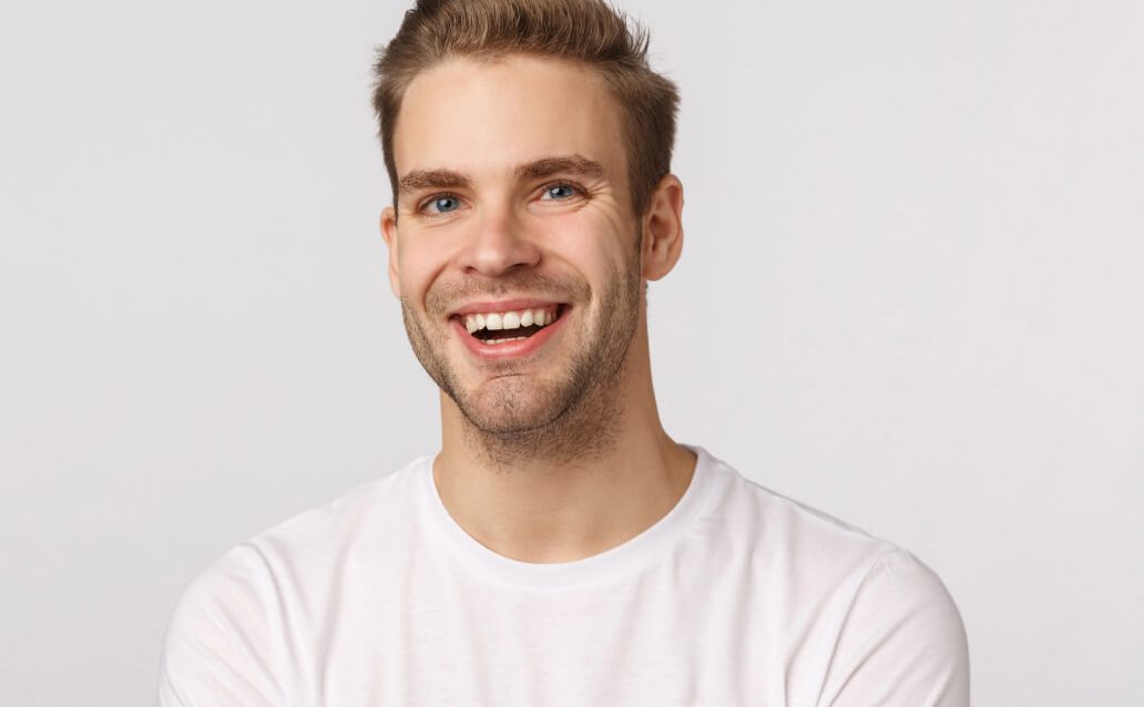handsome-blond-guy-with-blue-eyes-white-t-shirt-smiling 1